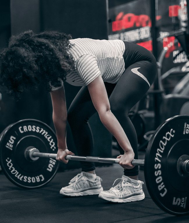 Woman performing beginner strength training exercise