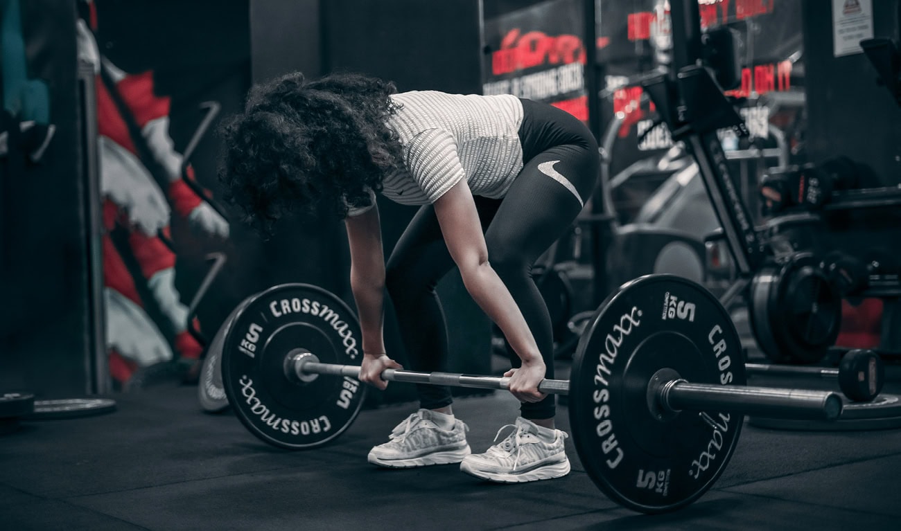 Woman performing beginner strength training exercise