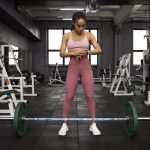 Woman performing strength training as part of a Balanced Workout Routine for Women.
